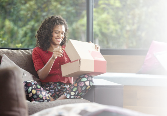 Customer-Experience-Background Woman opening package