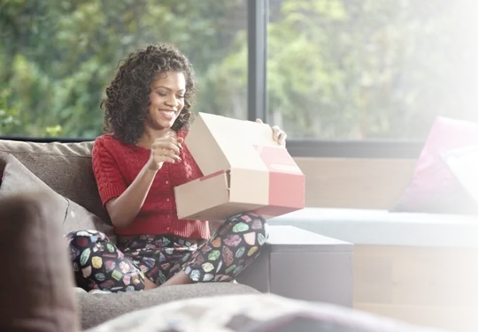 delighted customer opens package